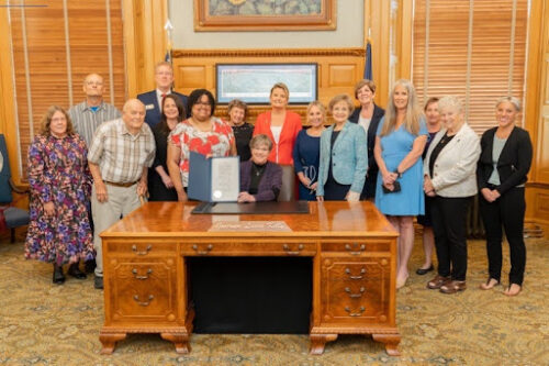 Advocates in Kansas attending the signing of the Purple Alert with Gov. Laura Kelly