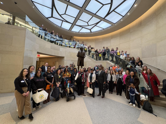 A group of advocates gathering in the Virginia State Capitol for Autism Advocacy Day, 