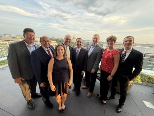 Image of Autism Society of America staff and board members along side three members of Congress - Representative Cuellar, Correa and Stauber.